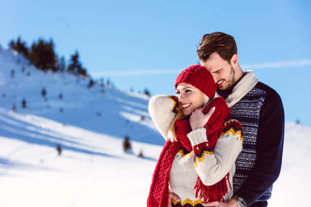 Happy Couple Having Fun on snow mountain.の写真素材