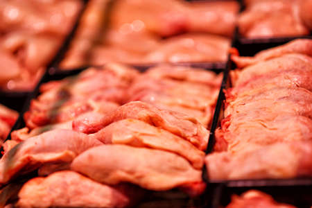 Heap of fresh raw meat food flesh background at shop supermarketの写真素材
