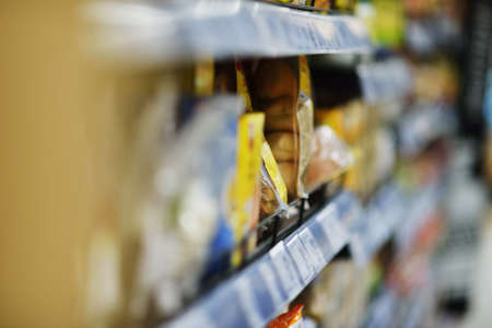 Woman shopping dairy product in grocery store