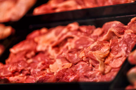 Heap of fresh raw meat food flesh background at shop supermarketの写真素材