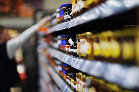Woman shopping dairy product in grocery storeの写真素材