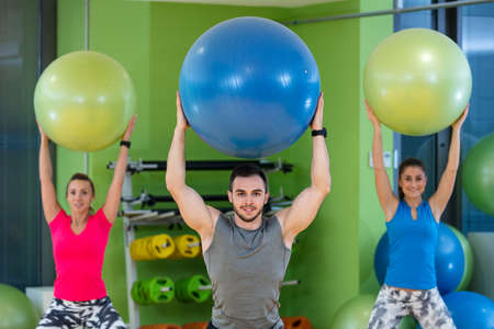 Group of people in a Pilates class at the gym