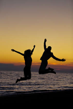 Silhouette of Lovely Couple at the beachの写真素材