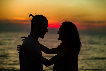 Silhouette of Lovely Couple at the beachの写真素材