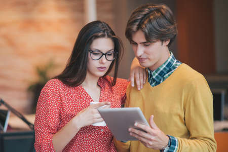 business couple working together on project at modern startup office