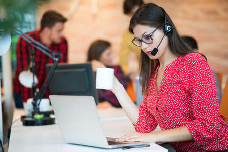 Young female in call center teamの写真素材