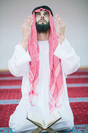 Muslim Arabic man prayingの写真素材