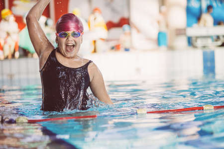 young and successful swimmers poseの写真素材