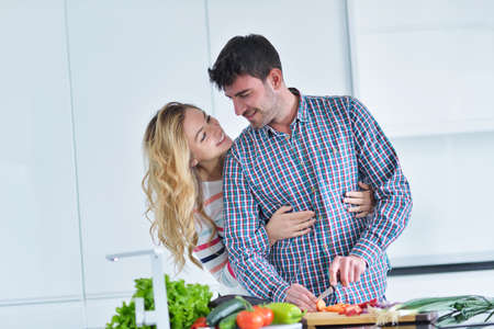 couple cooking healthy food in kitchen lifestyle meal preparation