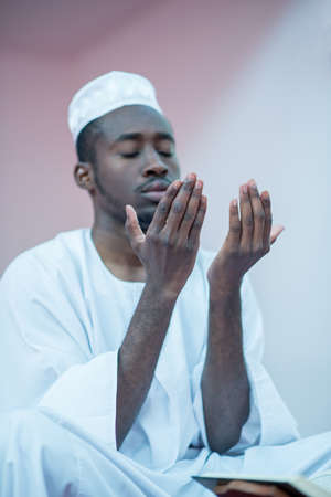 African Muslim Man Praying To Godの写真素材