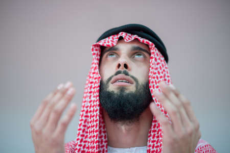Muslim Arabic man prayingの写真素材