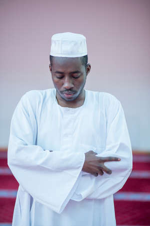 African Muslim Man Praying To Godの写真素材