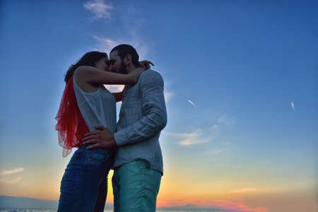 Silhouette of Lovely Couple at the beachの写真素材
