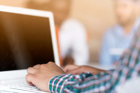 Image of mans hands typing. Selective focusの写真素材