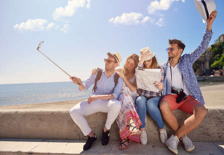 tourism, travel, people, leisure and technology concept