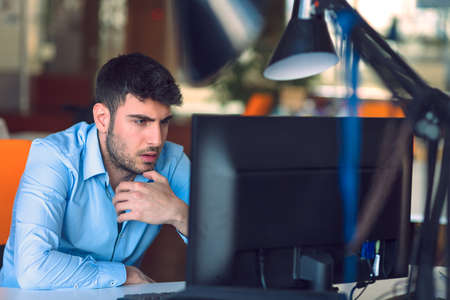 Freelance programmer working in startup officeの写真素材