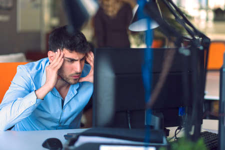 Freelance programmer working in startup office