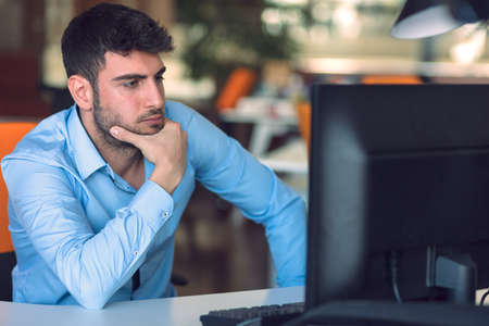 Freelance programmer working in startup office