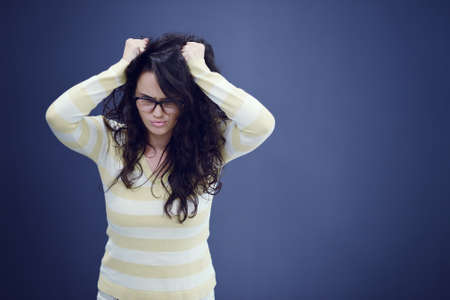 Secretary or business woman with suprised look on her face isolated over dark backgroundの写真素材