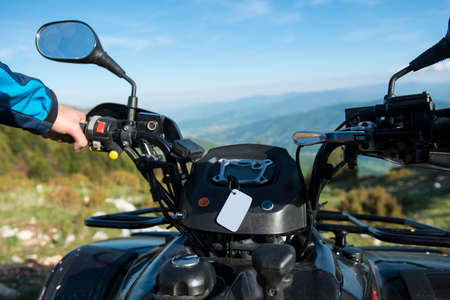 Young man on quad bike on a countryside trail. View from a quad bike.