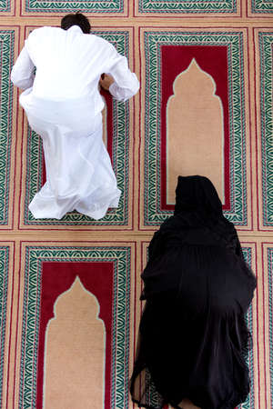 top view of Muslim man and woman praying in mosqueの写真素材