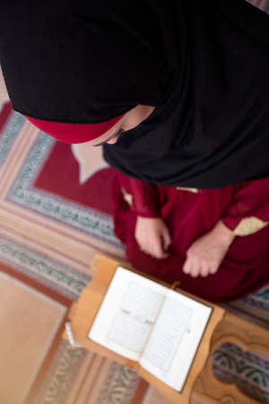 Young muslim woman praying in mosqueの写真素材
