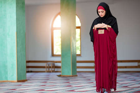 Young muslim woman praying in mosqueの写真素材