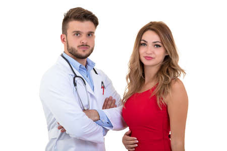 Smiling young doctor reassuring woman patient about medical results. Isolated on white.の写真素材