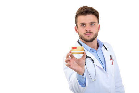 Pay secure using credit card for medical services. Doctor holding creditcardの写真素材