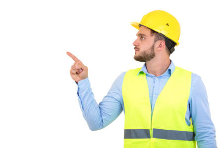Happy professional engineer pointing to something isolated on white background.