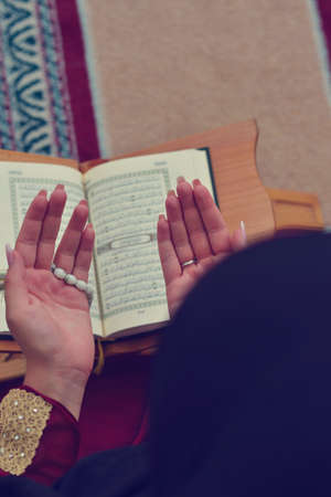 Young muslim woman praying in mosqueの写真素材