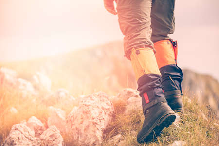 Mountain hiking. Lens flare, shallow depth of field.