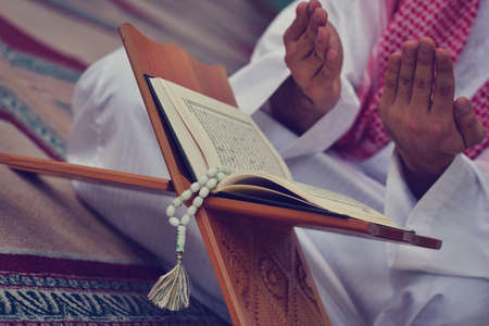 Religious muslim man praying inside the mosque