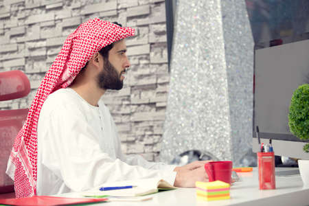 Arabian business man working on Laptop in the officeの写真素材