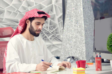 Arabian business man working on Laptop in the officeの写真素材