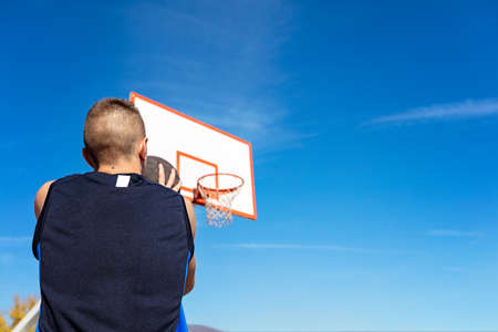 Young man shooting free throws from the foul line