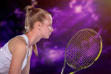 Woman playing tennis and waiting for the serviceの写真素材