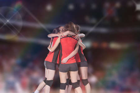 Woman volleyball Players celebrating victory and gold medalの写真素材
