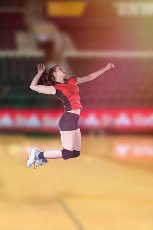 Female volleyball players jumping close-up on vollayball court.の写真素材
