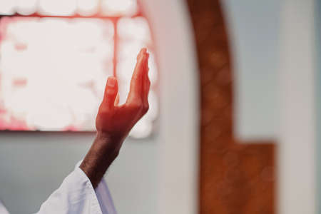 Hand of muslim black man people praying with mosque interior backgroundの写真素材