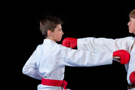 The studio shot of group of kids training karate martial artsの写真素材