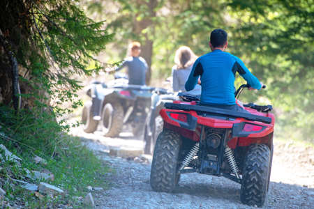 man riding atv vehicle on off road track ,people outdoor sport activitiies theme