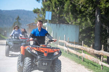 man riding atv vehicle on off road track ,people outdoor sport activitiies theme
