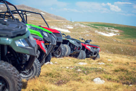 parked in a row several atv quad bikes extreme outdoor adventure concept