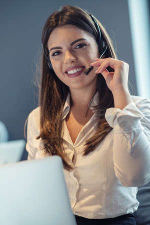 Customer Service agent in an startup office with laptop
