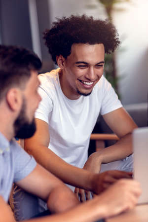Teamwork concept.Young creative coworkers working with new startup project in modern office.Group of...