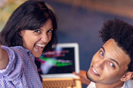 happy young african couple with laptop computer