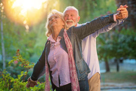 Happy senior couple in love. Park outdoors.