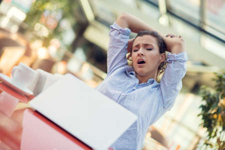 Young woman stressful, headache migraine, hand touch head feeling pain.の写真素材