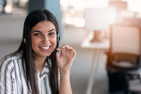 Happy smiling woman working in call center